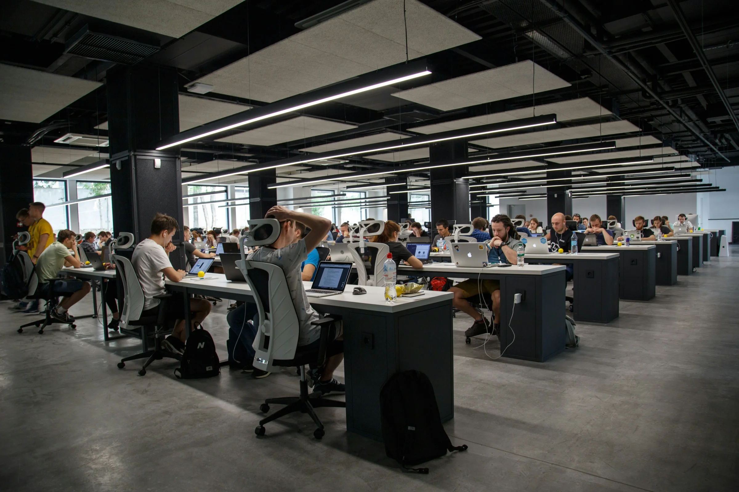 A large open office with rows of desks